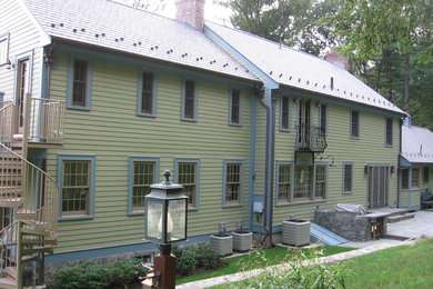 Transitional green two-story wood gable roof photo in Boston