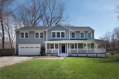 Inspiration for a large timeless gray two-story concrete fiberboard exterior home remodel in Bridgeport with a shingle roof