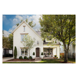 White Brick Home with Welcoming Gas Lantern & Sitting Area ...