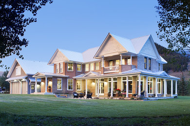 Example of a mid-sized cottage white two-story brick exterior home design in Denver