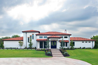 Large trendy white two-story brick flat roof photo in Oklahoma City