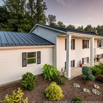 White House with Textured Black Standing Seam