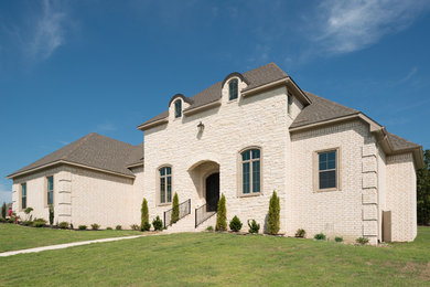 Inspiration for a white brick house exterior remodel in Little Rock