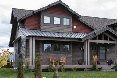 Large mountain style gray one-story wood exterior home photo in Other