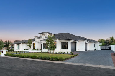 Large transitional white one-story stucco exterior home photo in Phoenix with a tile roof
