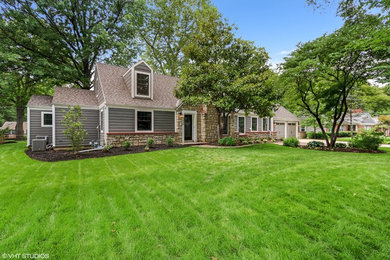 Inspiration for a mid-sized timeless gray one-story wood exterior home remodel in Kansas City with a shingle roof