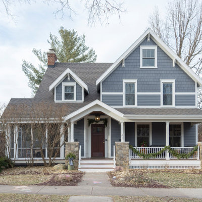 Mid-sized transitional gray two-story vinyl exterior home idea in Other with a shingle roof