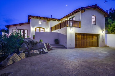 Huge transitional white two-story stucco exterior home photo in San Diego