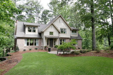 Example of a mid-sized transitional multicolored two-story mixed siding exterior home design in Atlanta with a shingle roof