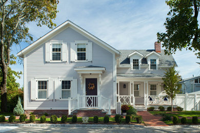 Inspiration for a mid-sized coastal gray one-story wood house exterior remodel in Providence with a shingle roof