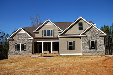 Inspiration for a timeless brown three-story mixed siding exterior home remodel in Atlanta