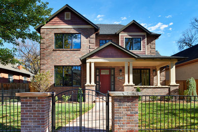 Example of a classic red brick exterior home design in Denver
