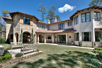 Example of a classic stone exterior home design in Houston