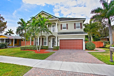 Large transitional two-story exterior home photo in Miami