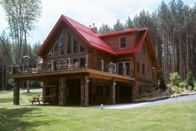 Inspiration for a large craftsman red two-story wood exterior home remodel in Portland Maine with a clipped gable roof