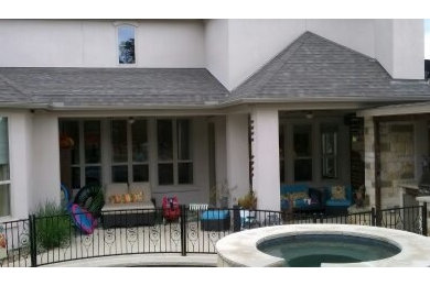 Foto de fachada de casa multicolor de estilo americano de tamaño medio de dos plantas con revestimiento de aglomerado de cemento, tejado plano y tejado de teja de madera