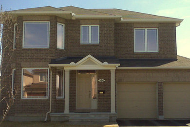 Example of a mid-sized classic multicolored two-story exterior home design in Ottawa