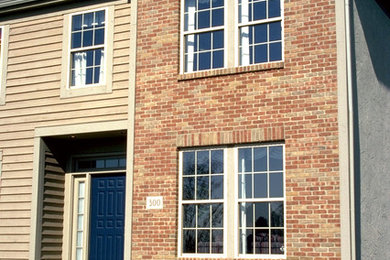 Example of a mid-sized transitional two-story mixed siding exterior home design in Columbus with a hip roof