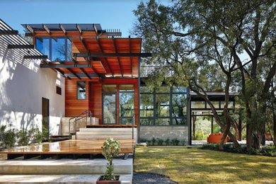 Inspiration for a mid-sized modern white two-story brick exterior home remodel in Dallas with a tile roof