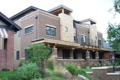 Photo of a large and brown two floor brick house exterior in Denver.