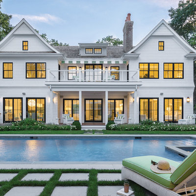 Large traditional white two-story concrete fiberboard gable roof idea in Chicago