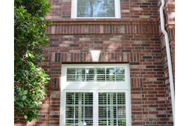 Photo of a medium sized two floor brick house exterior in Houston.