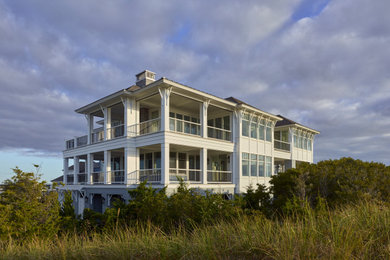 Huge coastal gray two-story wood house exterior idea in Other with a clipped gable roof and a shingle roof