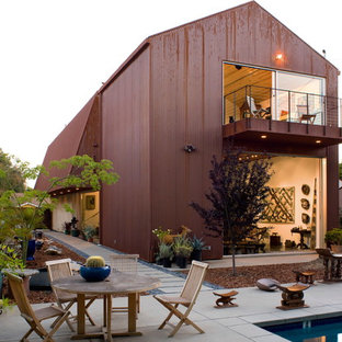 Design ideas for a red modern two floor detached house in Los Angeles with metal cladding, a pitched roof and a metal roof.