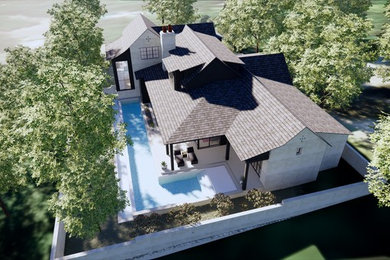 Ejemplo de fachada de casa blanca clásica renovada de tamaño medio de dos plantas con revestimiento de ladrillo, tejado a dos aguas y tejado de teja de madera
