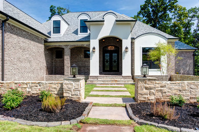 Example of a transitional exterior home design in Little Rock