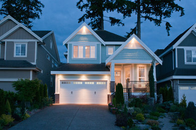 Inspiration for a mid-sized blue two-story wood exterior home remodel in Vancouver