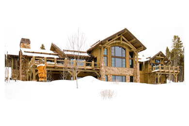 Example of a large mountain style green three-story wood gable roof design in Denver