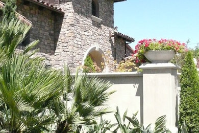 Example of a farmhouse exterior home design in Orange County