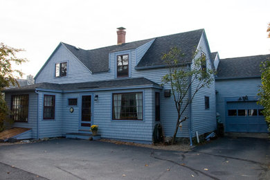 Example of a mid-sized two-story mixed siding exterior home design in Portland Maine