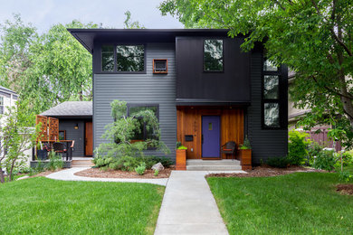 Inspiration for a contemporary gray two-story exterior home remodel in Minneapolis