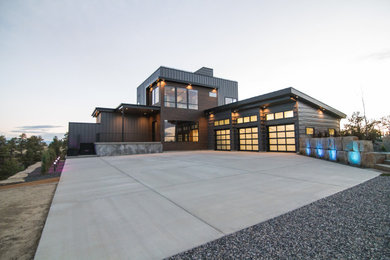 Trendy gray two-story metal exterior home photo in Other