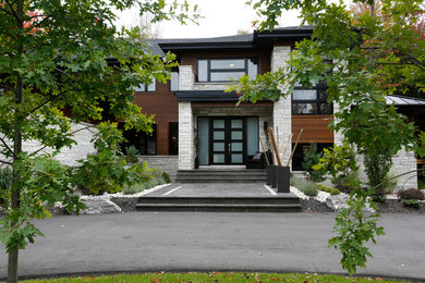 Contemporary exterior home idea in Montreal