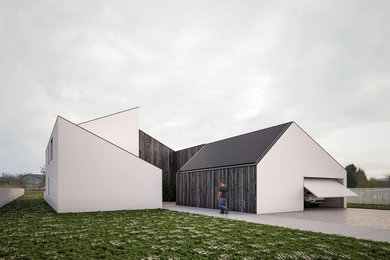 Idée de décoration pour une grande façade de maison blanche design en bois à un étage avec un toit à deux pans.