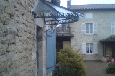 Example of a classic exterior home design in Dijon