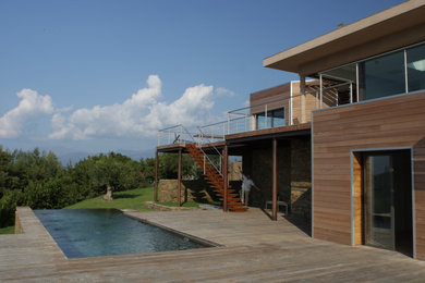 Design ideas for a contemporary house exterior in Corsica.