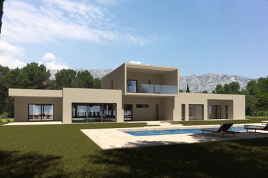 Ejemplo de fachada de casa beige contemporánea grande de dos plantas con revestimientos combinados, tejado plano y techo verde