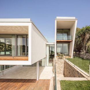Ejemplo de fachada de casa blanca, contemporánea, con tejado de un solo tendido