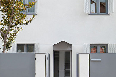 Foto de fachada de casa pareada moderna grande de tres plantas con tejado a dos aguas y tejado de teja de barro