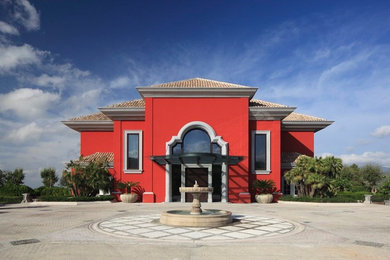 Foto de fachada de casa roja tradicional renovada extra grande de tres plantas con revestimientos combinados, tejado a cuatro aguas y tejado de varios materiales