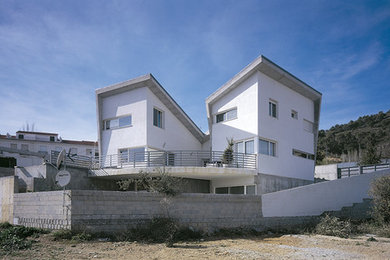 Ejemplo de fachada de casa contemporánea con revestimiento de hormigón
