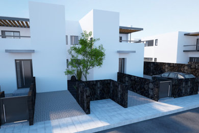 Imagen de fachada de casa blanca minimalista de dos plantas con tejado plano