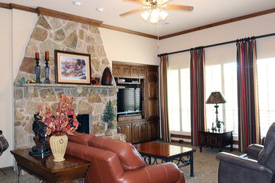 This is an example of a medium sized traditional open plan games room in Dallas with beige walls, carpet, a standard fireplace, a stone fireplace surround, a built-in media unit and beige floors.