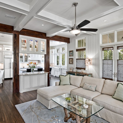 Family room - traditional open concept dark wood floor family room idea in Miami with white walls