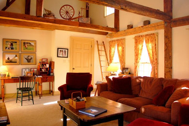 Example of a mid-sized farmhouse carpeted and beige floor family room design with white walls, no tv and no fireplace