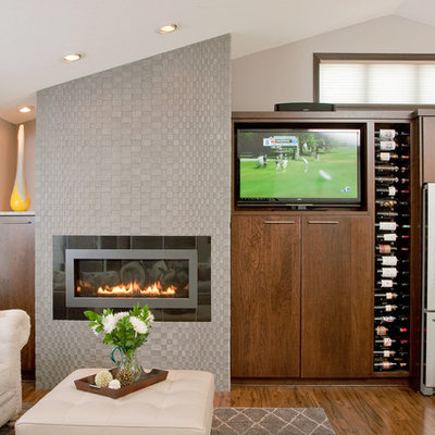 Example of a mid-sized trendy open concept medium tone wood floor and brown floor family room design in Minneapolis with beige walls, a ribbon fireplace, a tv stand and a tile fireplace